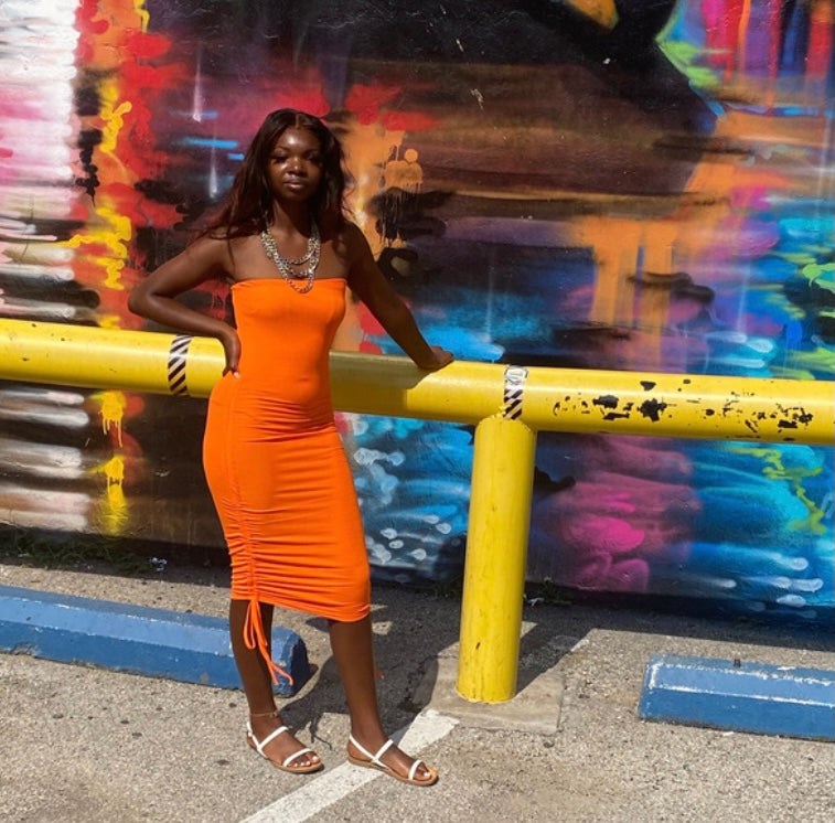 tiana orange dress The Tiana Dress is a little bit different for us, but we liked it. The shape is nice, and it's fitted which is the different part, but you'll love wearing this one